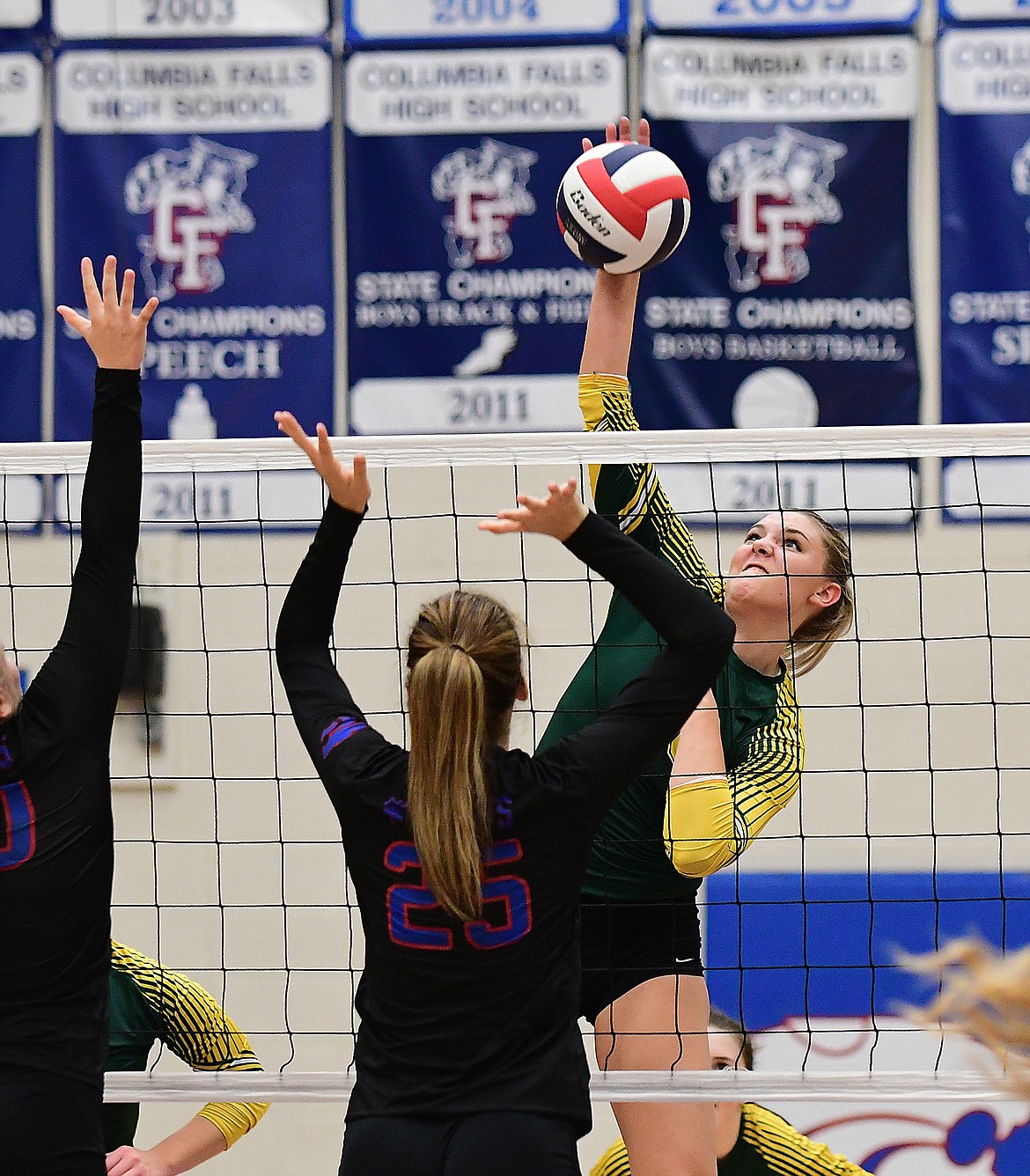 Cailyn Ross nails the ball at the net on Thursday against Columbia Falls.