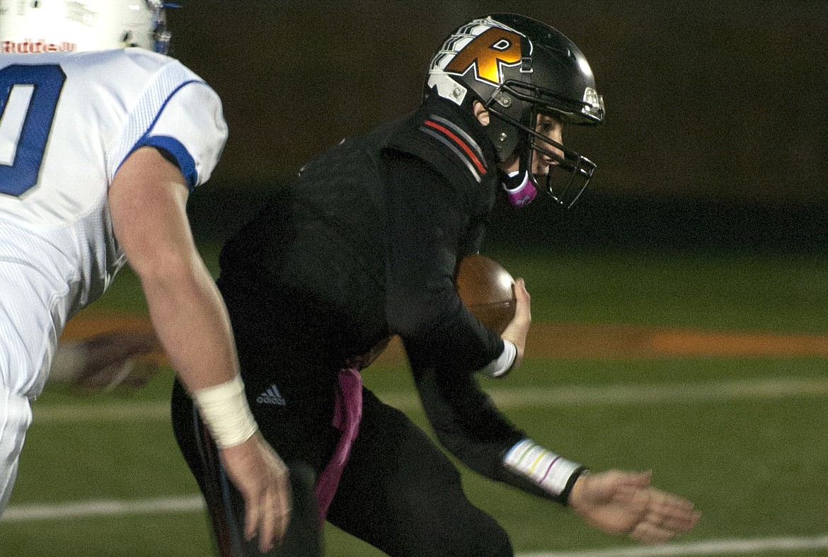 RONAN QUARTERBACK Eric Dolence scrambles to try to get a first down in Oct. 6 regular season matchup with Columbia Falls. Dolence has been one of the key pieces that has allowed the Chiefs to stay in the playoff picture. The sophomore became the starter after his brother Brendon Blood was injured in the season-opener with Butte Central at Ronan High School. Dolence has been the starting quarterback since the injury. (Photo by Jeremy Weber/Lake County Leader)