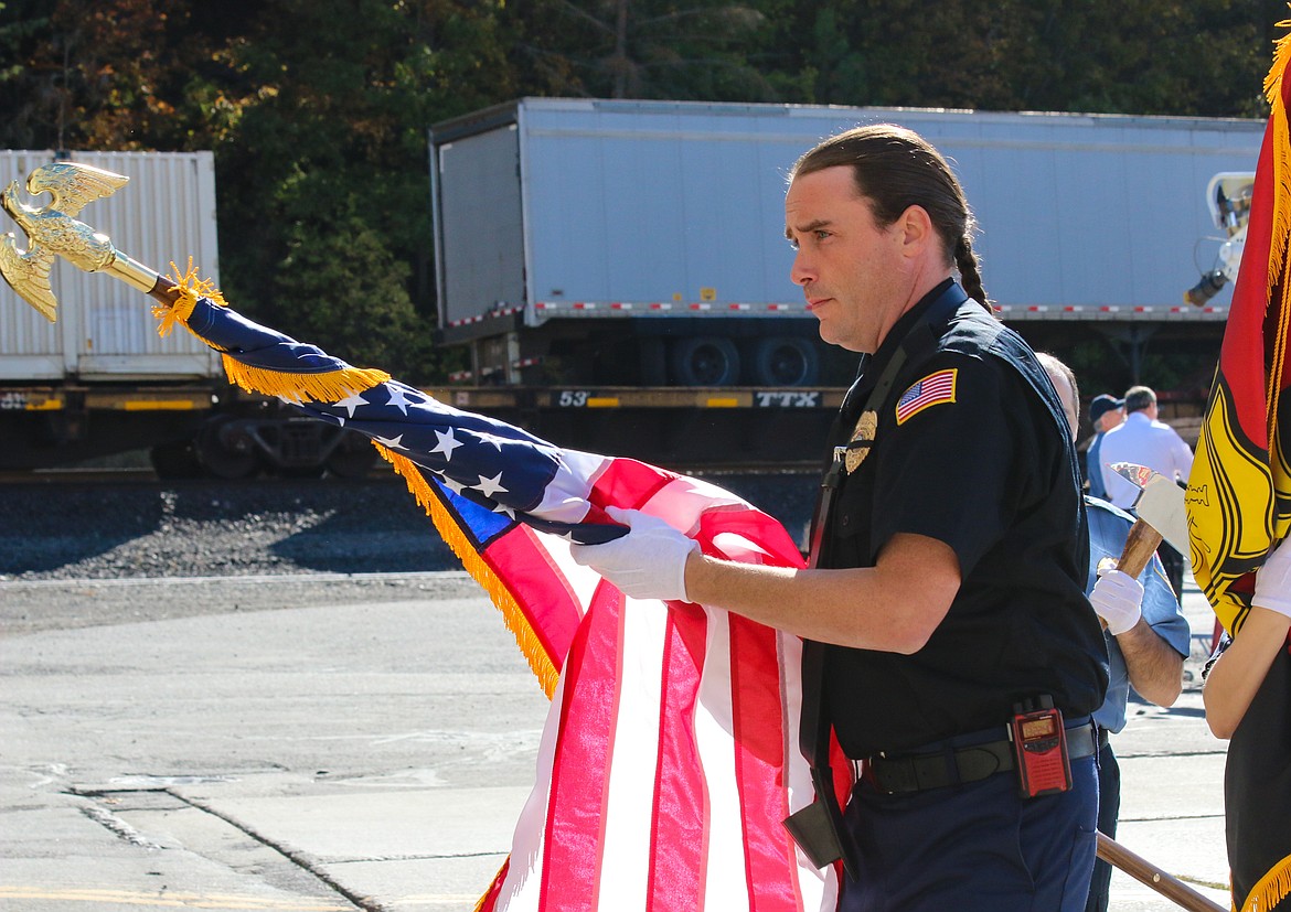 Photo by Mandi Bateman
Honor Guard member, Hall Mountain Firefighter Wally Nyberg, takes the flag inside during the practice right before the cerimony.