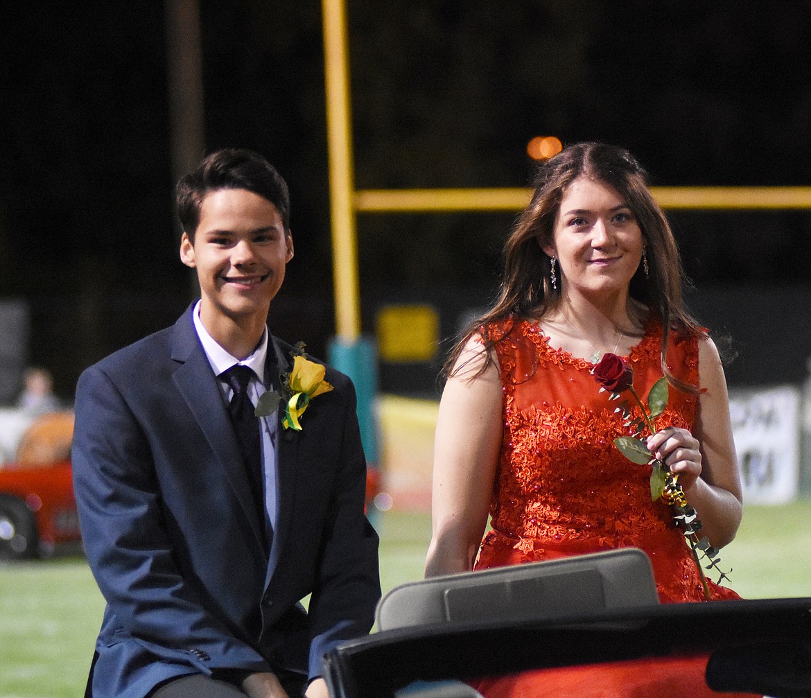 Quinten Joos and Marlee Bender smile for the crowd during homecoming celebrations at Friday&#146;s game against Polson.