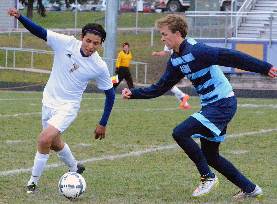 POLSON HIGH School soccer player Alex Encizo attempts to move the ball forward in the Pirates offensive attack against Loyola Sacred-Heart in the Class A quarterfinals Saturday afternoon at Polson High School. (Jason Blasco/Lake County Leader)