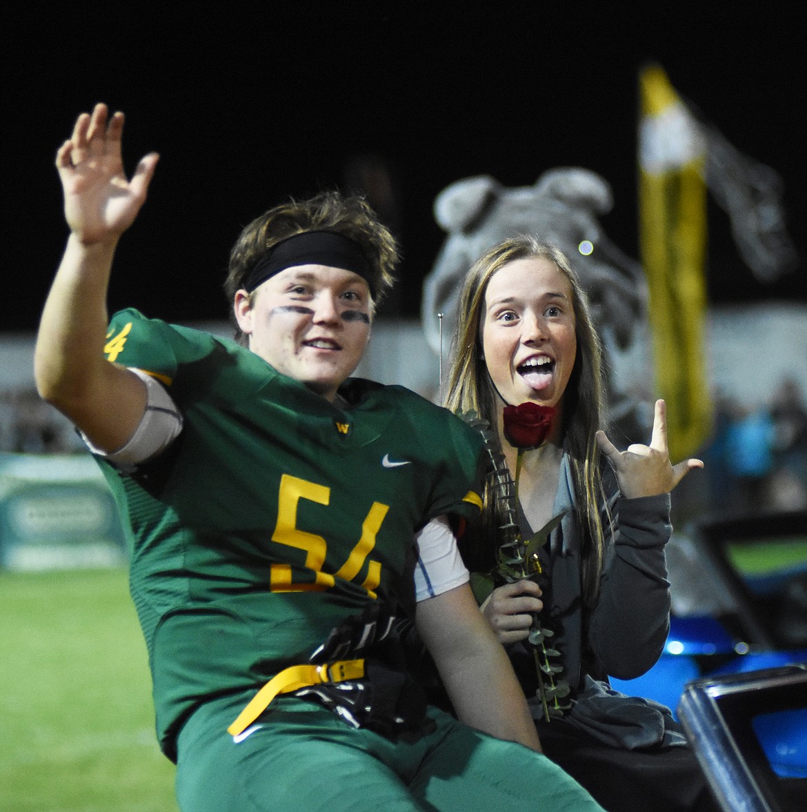 Aalec Pace and Gracie Young ride down the field during halftime homecoming celebrations Friday night.