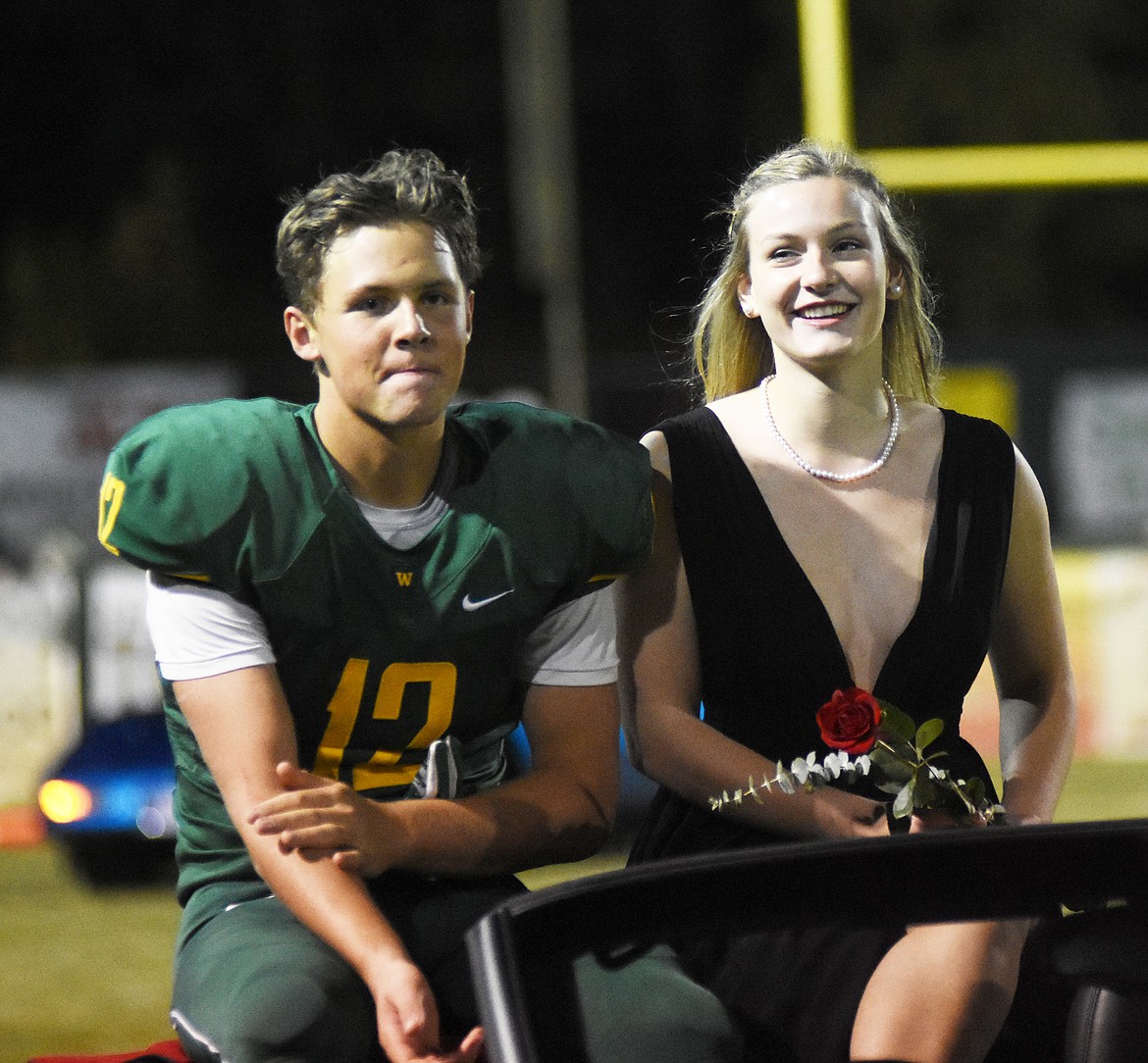 Forrest Kobelt and Becca Catina are greeted by the crowd during homecoming celebrations on Friday.