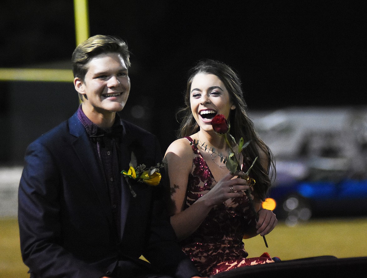 Avery Hirsch and Grayson Grorian laugh as they ride down the field at halftime of Friday night&#146;s homecoming game.