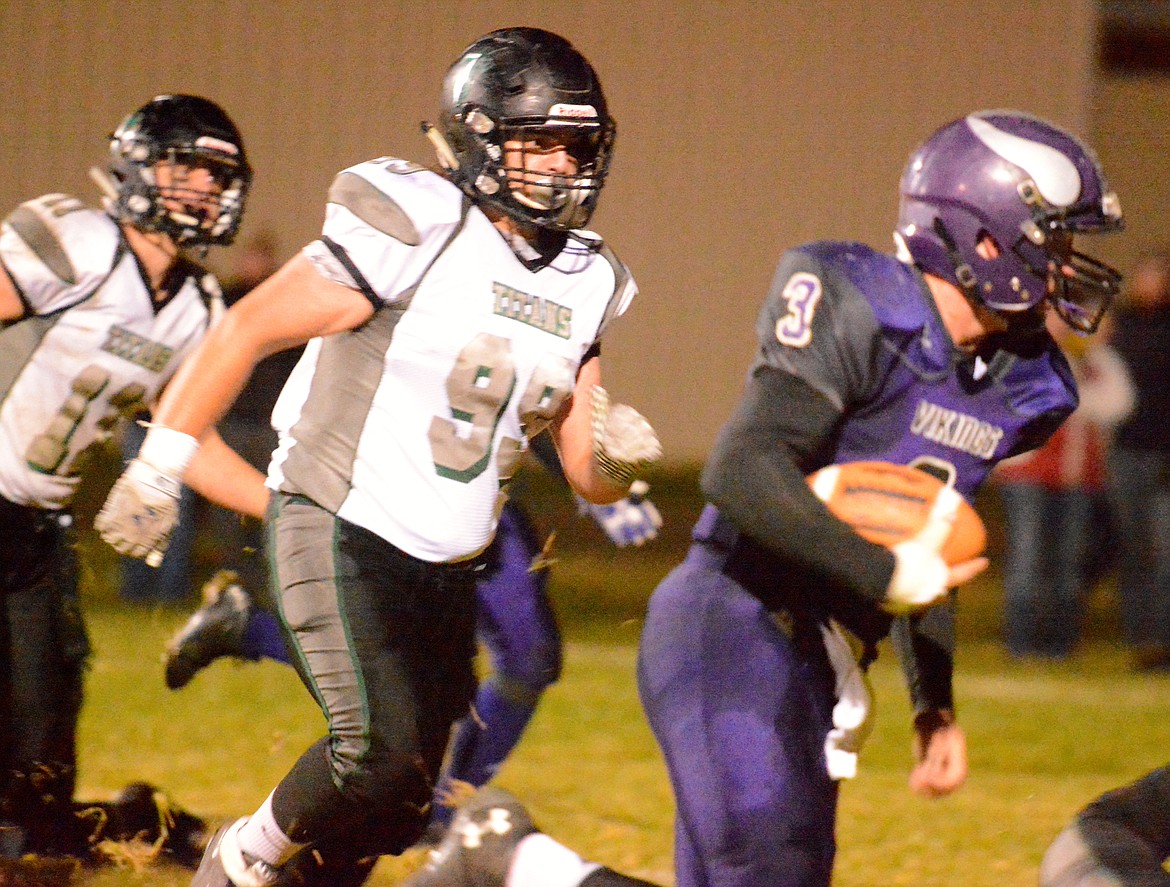 VIKINGS QUARTERBACK Landers Smith finds a lane against the Flint-Creek defense in the Charlo-Flint Creek game Friday night at Charlo High School. The Vikings&#146; 28-46 loss prevented them from clinching home field advantage throughout the duration of the Class C, 8-man MHSA state football tournament. (Photo by Jason Blasco/Lake County Leader)