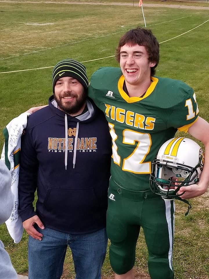 St. Regis senior Ryan Teeter with Head Coach, Jesse Allan. Teeter was honored as the team&#146;s lone senior last weekend. The Tigers ended their season early due to lack of players. (Photo courtesy of Jim Booker).