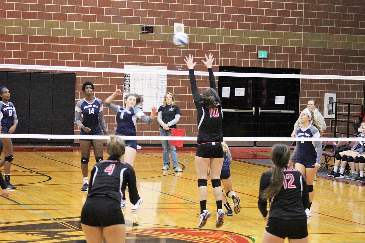 Photos by Chanse Watson/ 
Jen Hayman goes up for a block during Friday&#146;s game against Genesis Prep.
