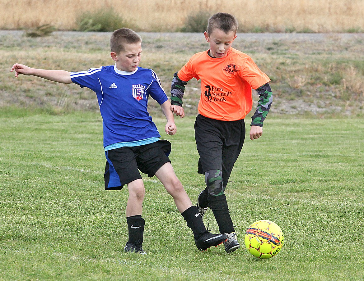 The Superior Stompers took on the Plains Nightmares and Superior&#146;s Gannon Quinlan kicks past Plains Andrew Wrobleski during a U10 team matchup on Sept. 29 where Plains won 5-2. (Photo by Ed Moreth)