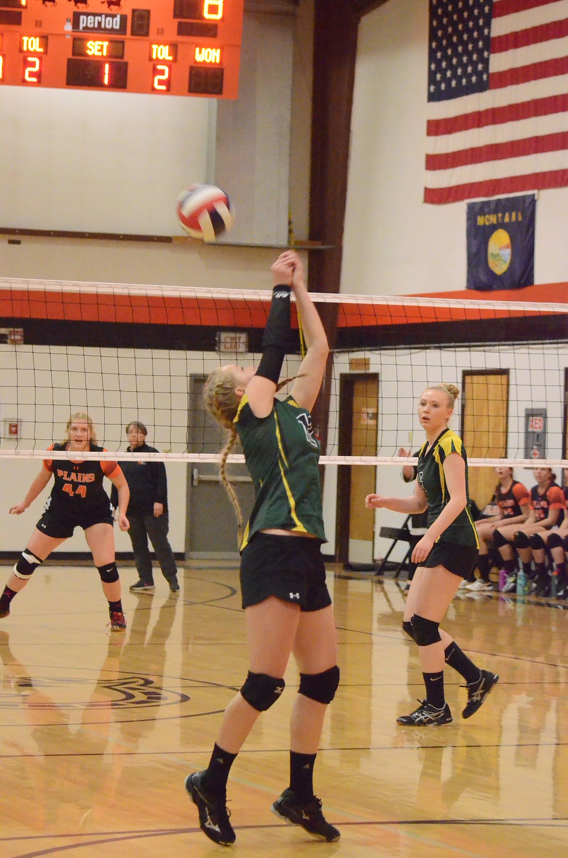 St. Regis Emmah Hill (No. 12) bumps the ball back over to the Trotters during last Tuesday&#146;s game in Plains. The Lady Tigers lost to Plains. (Erin Jusseaume/Clark Fork Valley Press).