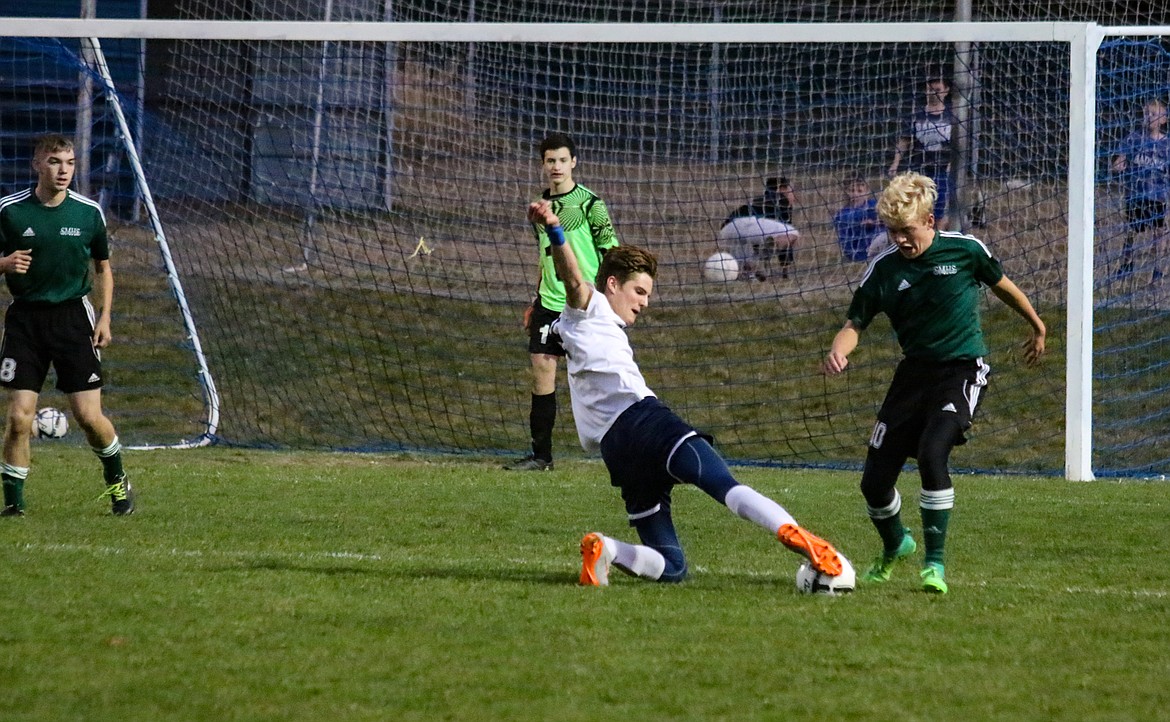 Photo by Mandi Bateman
Judah Draxlir attempting to win the ball from St. Marie&#146;s defense.