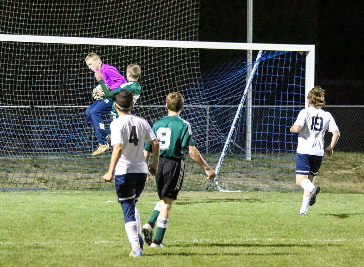 Photo by Mandi Bateman
Keeper Seth Bateman grabs a ball away from St. Marie&#146;s forward.