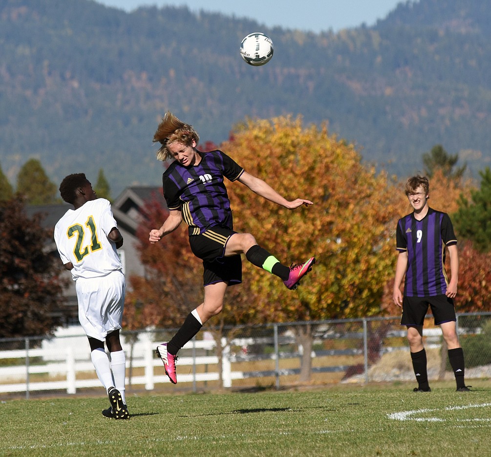 POLSON HIGH School player Bridger Wenzel blast the ball past midfield in a recent regular season contest against Whitefish at Whitefish High School. (photo by Daniel McKey/Special to the Leader)