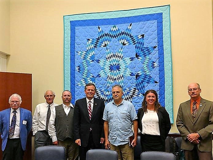 Photo caption:
St. Regis resident, John Woodland (far left) was part of a group of Montana delegates who met with Mont. Senators Steve Daines (center) and Jon Tester (not pictured) to discuss climate change and EPA budget cuts in Washington D.C. last month. (Photo courtesy of John Woodland).