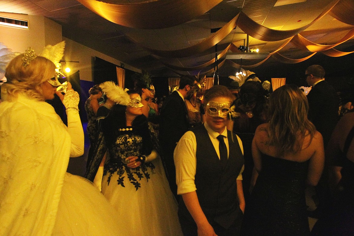 DEVIN HEILMAN/Press
Chelsea Bowmer of Coeur d&#146;Alene glides through the crowd at the Masquerade Charity Ball in the Greyhound Park and Event Center on Saturday night, where 400 guests danced, dined and enjoyed a variety of live entertainment.