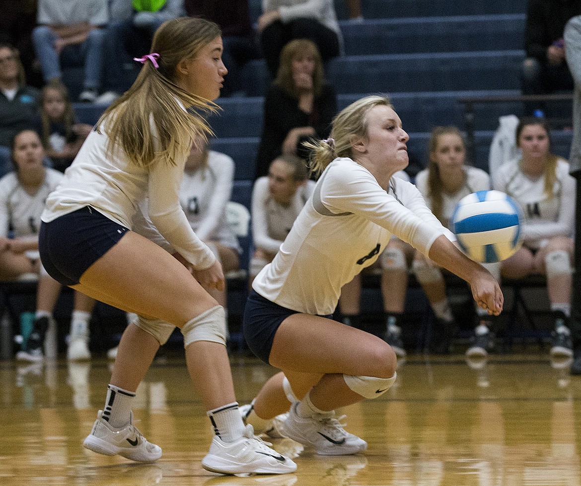 LOREN BENOIT/Press

Lake City's Chloe Knudson, right, digs a hit from a Post Falls player during last week's 5A Region 1 championship match.