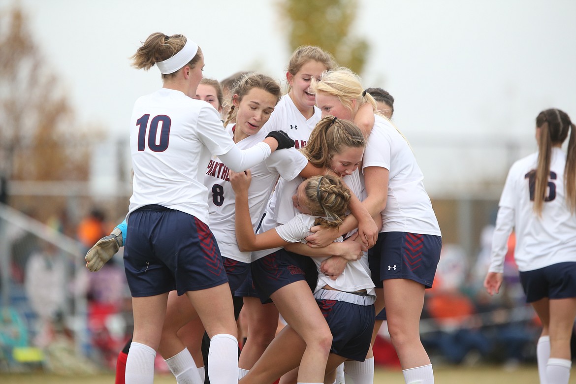 JASON DUCHOW/JasonDuchowPhotography.com
Coeur d&#146;Alene Charter Academy players celebrate after beating Shelley 1-0 in the championship game of the state 3A girls soccer tournament Saturday at Middleton High.