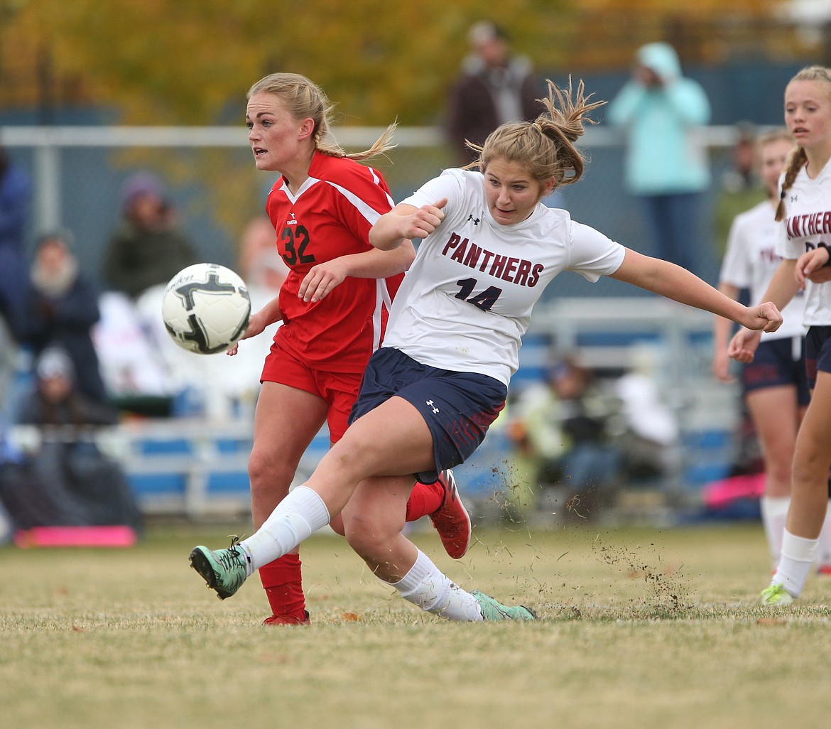 JASON DUCHOW/JasonDuchowPhotography.com
Sophomore midfielder Sandy Faulkner of Coeur d'Alene Charter Academy sends a pass ahead against Shelley in the championship game of the state 3A girls soccer tournament Saturday at Middleton High.