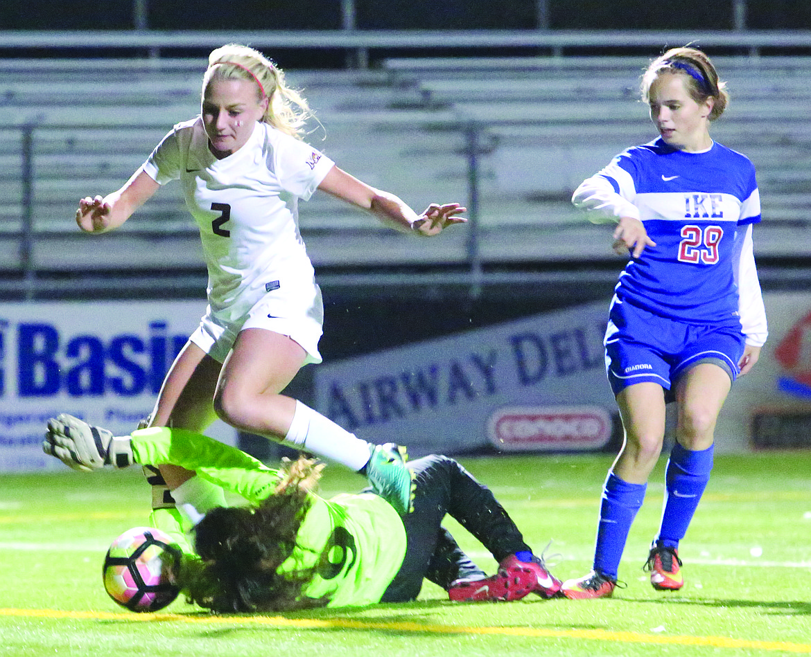 Connor Vanderweyst/Columbia Basin Herald
Moses Lake forward Madi Krogh (2) collides with Eisenhower goalie Jaqueline Renteria.