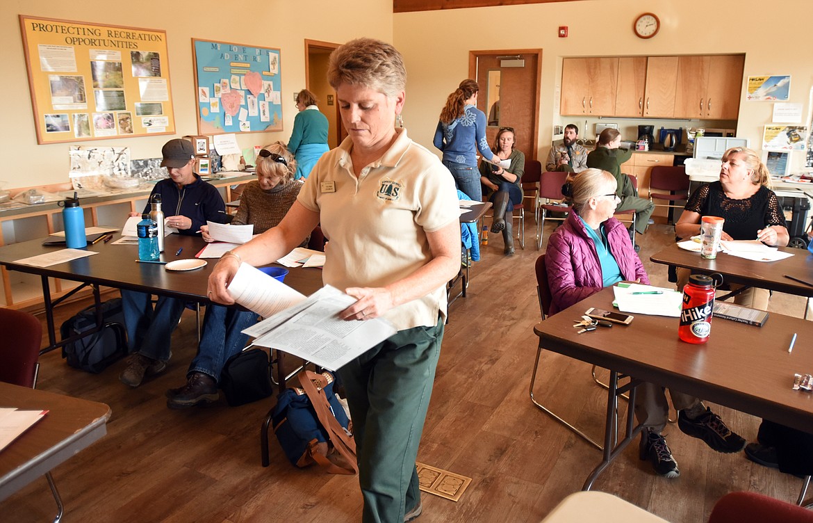 Teresa Wenum of Flathead National Forest collects forms from educators attending the annual trunk education workshop on Thursday, October 19 at Lone Pine State Park.(Brand Ahearn/Daily Inter Lake)