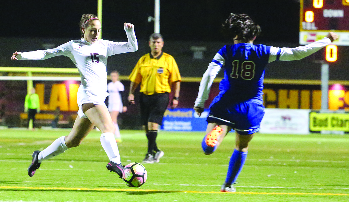 Connor Vanderweyst/Columbia Basin Herald
Moses Lake midfielder Christina Mullan handles the ball past Eisenhower's Bryana Rivera.