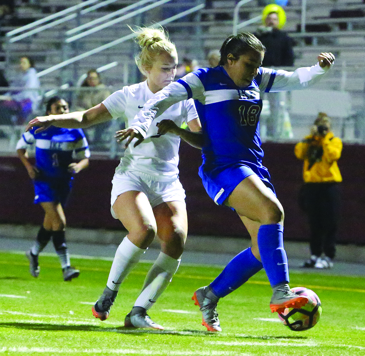 Connor Vanderweyst/Columbia Basin Herald
Moses Lake forward Kennady Schlagel tries to steal the ball from Eisenhower's Bryana Rivera.