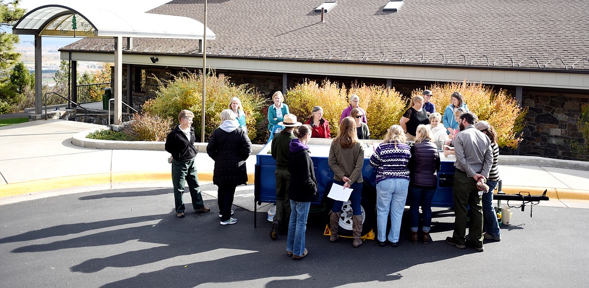 Teachers from around the Flathead gather around a rolling trailer at the annual trunk education workshop on Thursday, October 19 at Lone Pine State Park.(Brand Ahearn/Daily Inter Lake)