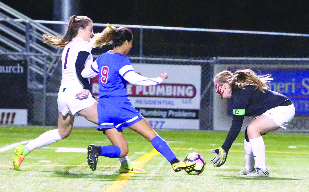 Connor Vanderweyst/Columbia Basin Herald
Moses Lake goalie Erin Manly, who has been sidelined with injuries, makes a save against Eisenhower.