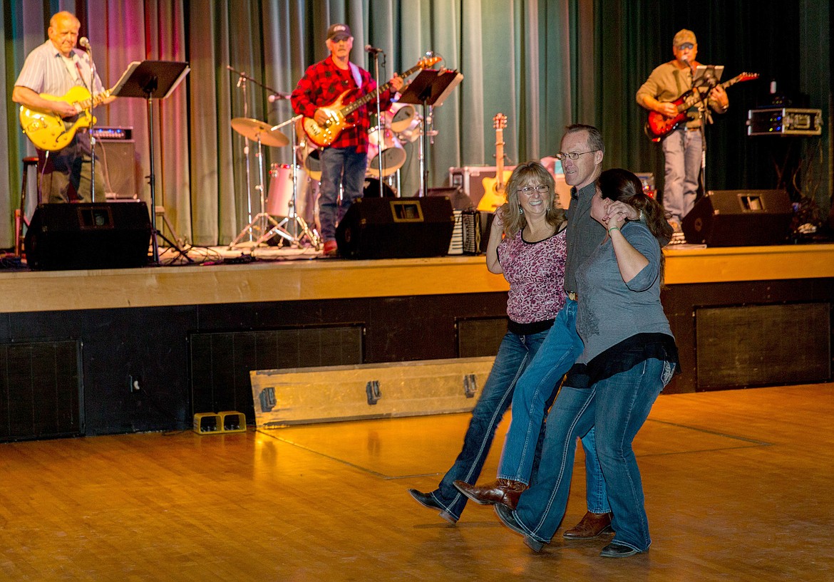 People dance to the band Country Legends at the &#147;Fire Relief Jamboree&#148; at the Libby Memorial Events Center Saturday, Oct. 21, 2017. (John Blodgett/The Western News)