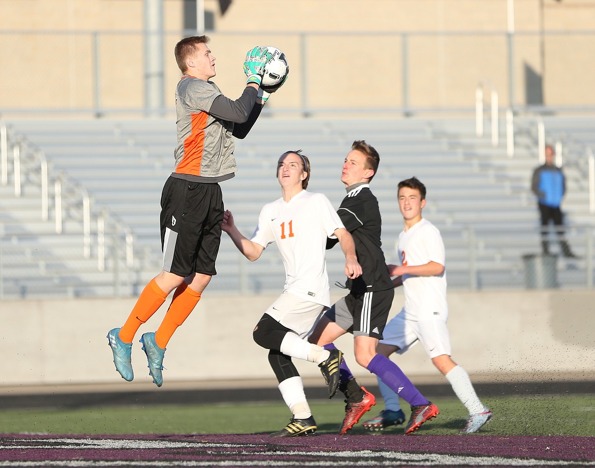 JASON DUCHOW/JasonDuchowPhotography.com
Tanner McCliment-Call of Post Falls makes a save against Rocky Mountain in a first-round game of the state 5A boys soccer tournament at Rocky Mountain High in Meridian. Post Falls won 3-1.