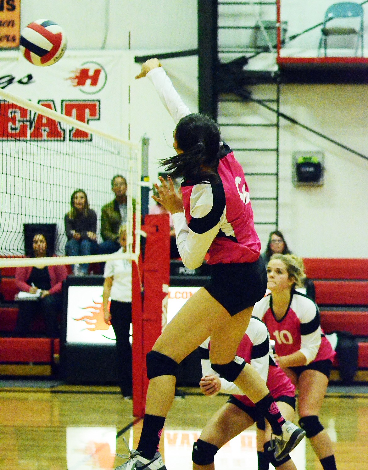 Danielle Cannon (6) gets some lift as she spikes the ball at the net for another point racked up by the Hot Springs Lady Savage Heat. (Erin Jusseaume photos/ Clark Fork Valley Press)