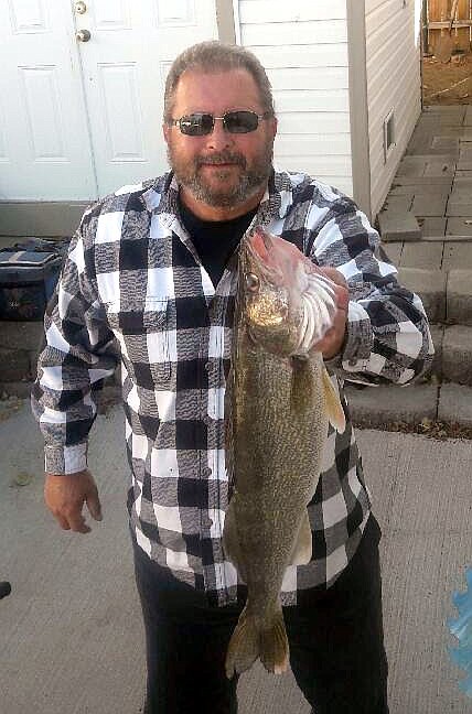 Pete Fisher photo - David McSherry of MarDon Resort shows a nice 24 inch Potholes Reservoir walleye.