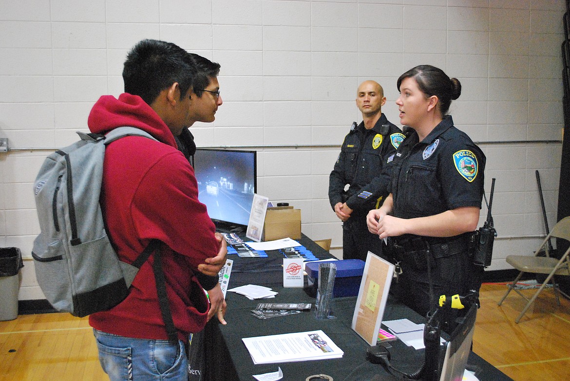 Bob Kirkpatrick/The Sun Tribune - The Othello Police Department booth was one of the most popular stops at the Career Showcase.