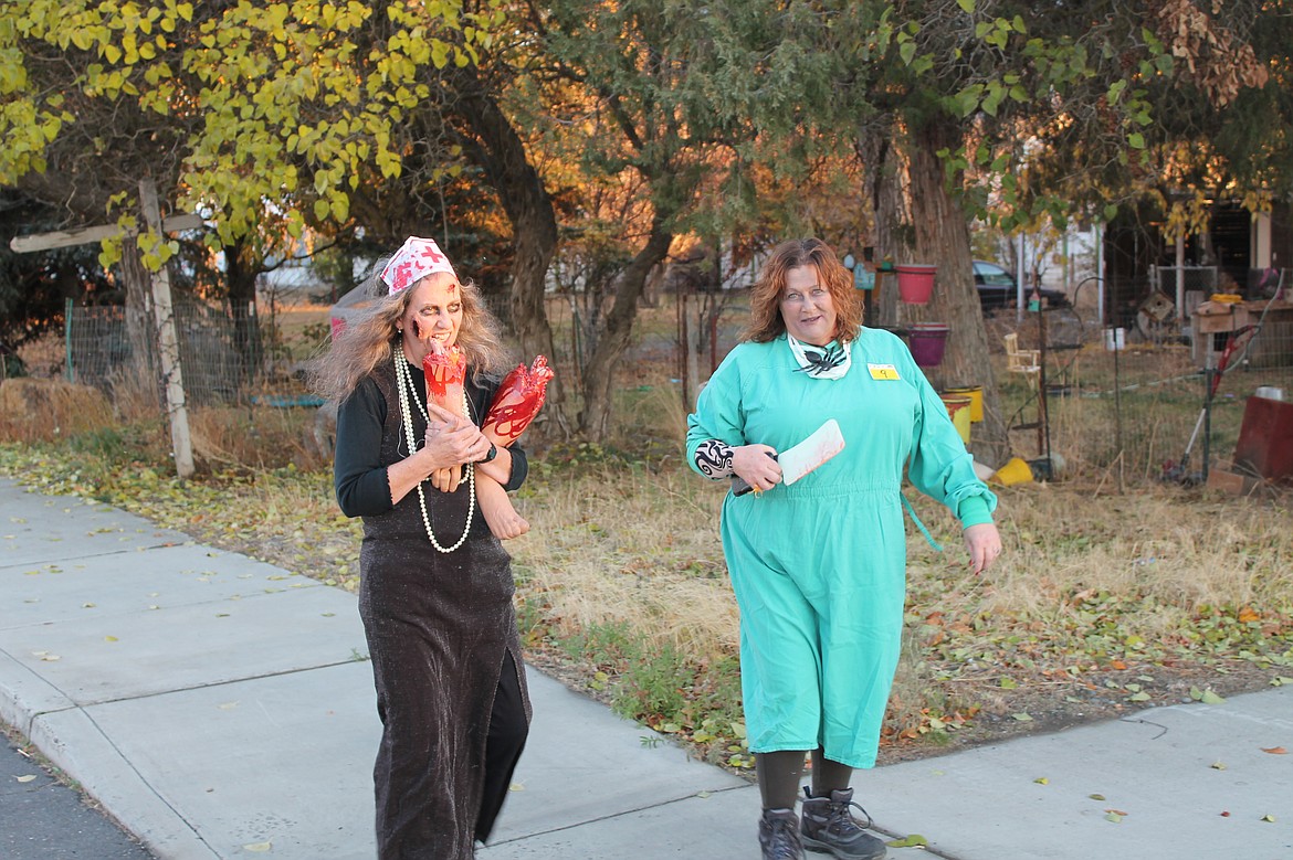 Joel Martin/Columbia Basin Herald
P.J. Jacobsen, left, and Jamie Schmunk make up the lunatic-medical professional contingent of the Lind Zombie Walk Saturday.