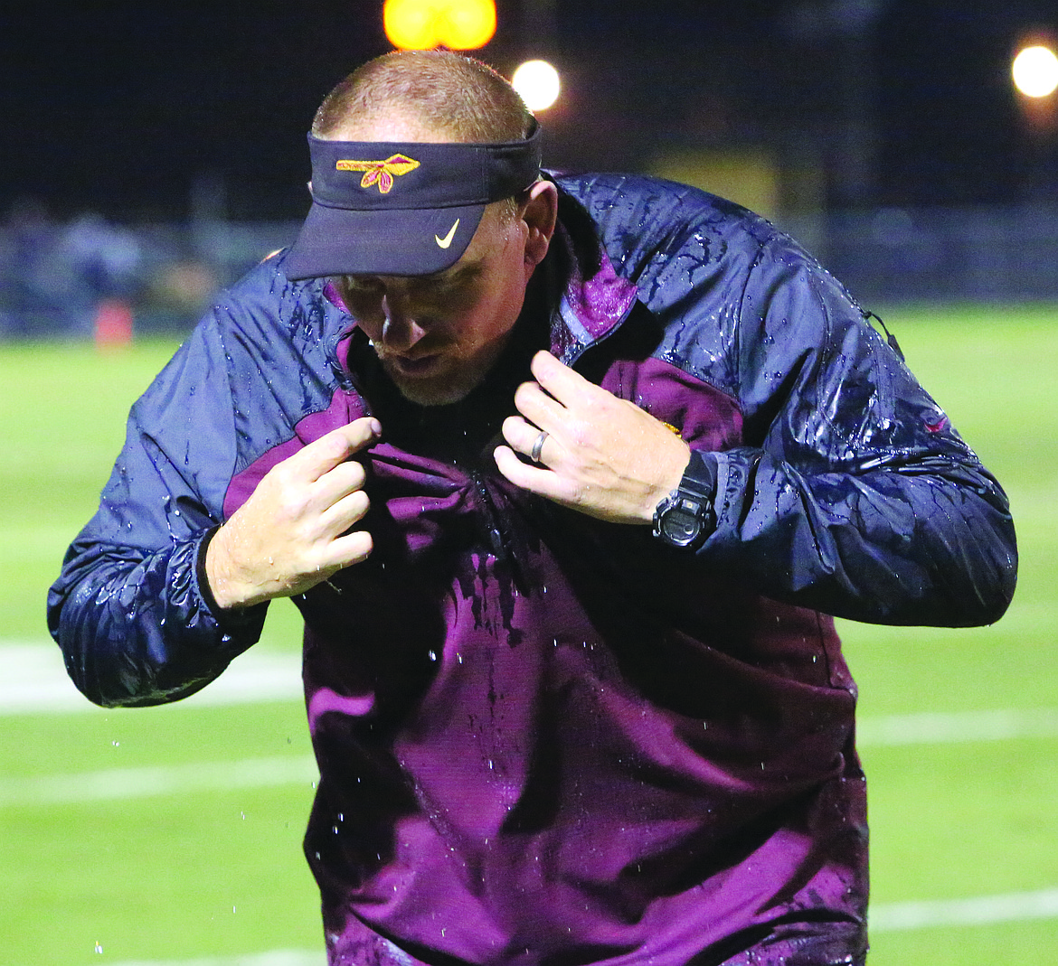 Connor Vanderweyst/Columbia Basin Herald
Moses Lake head coach Todd Griffith tries to dry himself after getting doused with water.