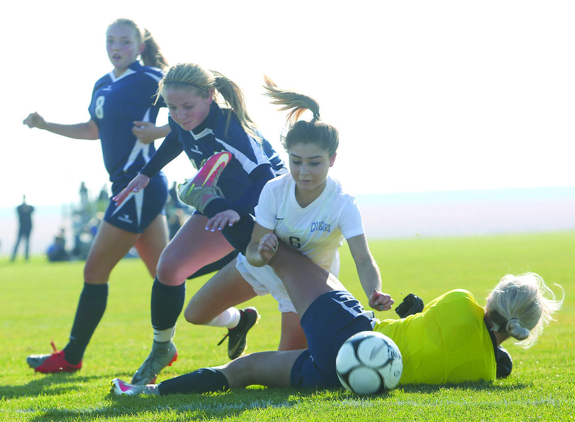 Connor Vanderweyst/Columbia Basin Herald
Warden's Aaliyah Escamilla collides with Naches Valley goalie Torrie Hoover.