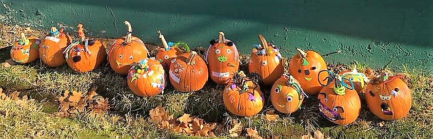 Pumpkins decorated as silly and scary monsters lined the Mineral County Library after the decorating party. (Photo by Florence Evans)