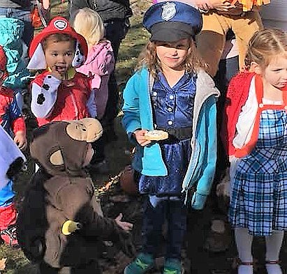 Kids gathered for the costume contest where contenstants were judged by age groups. (Photo by Florence Evans)