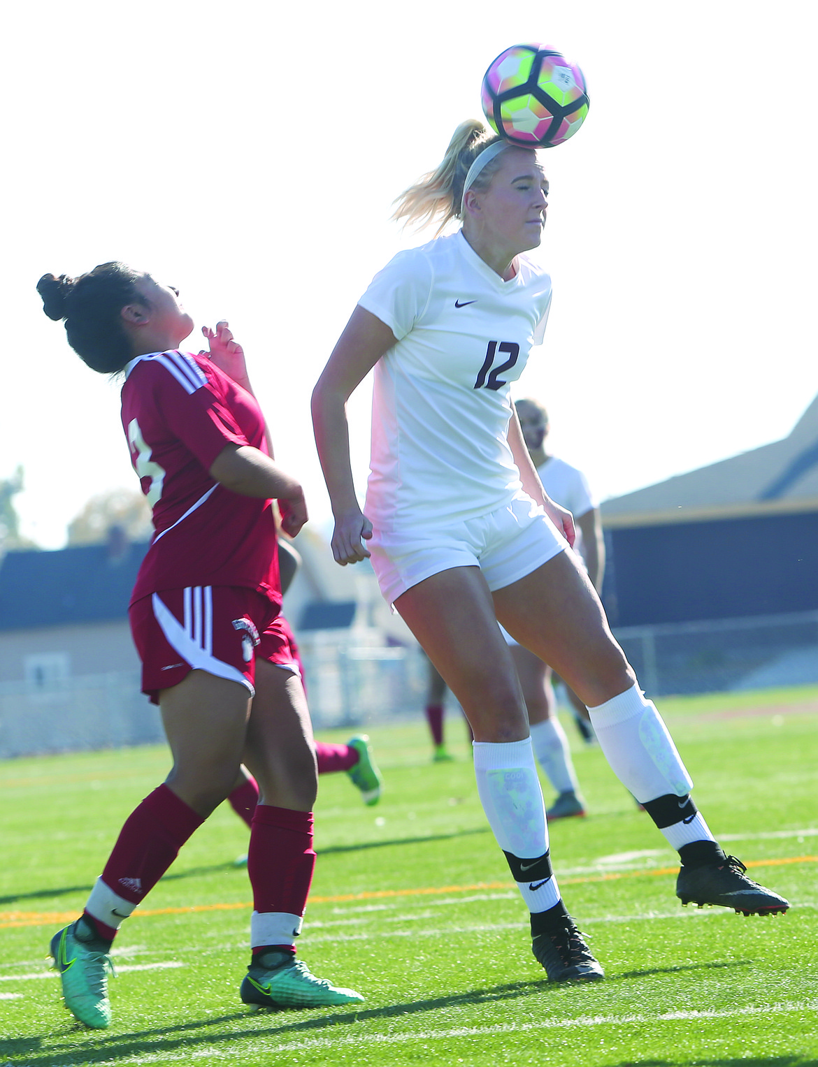 Connor Vanderweyst/Columbia Basin Herald
Moses Lake midfielder Morgan Skone heads the ball against Sunnyside.