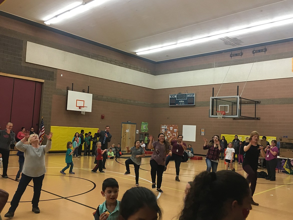 Chanet Stevenson/The Sun Tribune - Red Rock Elementary School faculty surprised guests of the Fall Harvest Festival with a flash mob dance routine to &quot;Thriller.&quot;