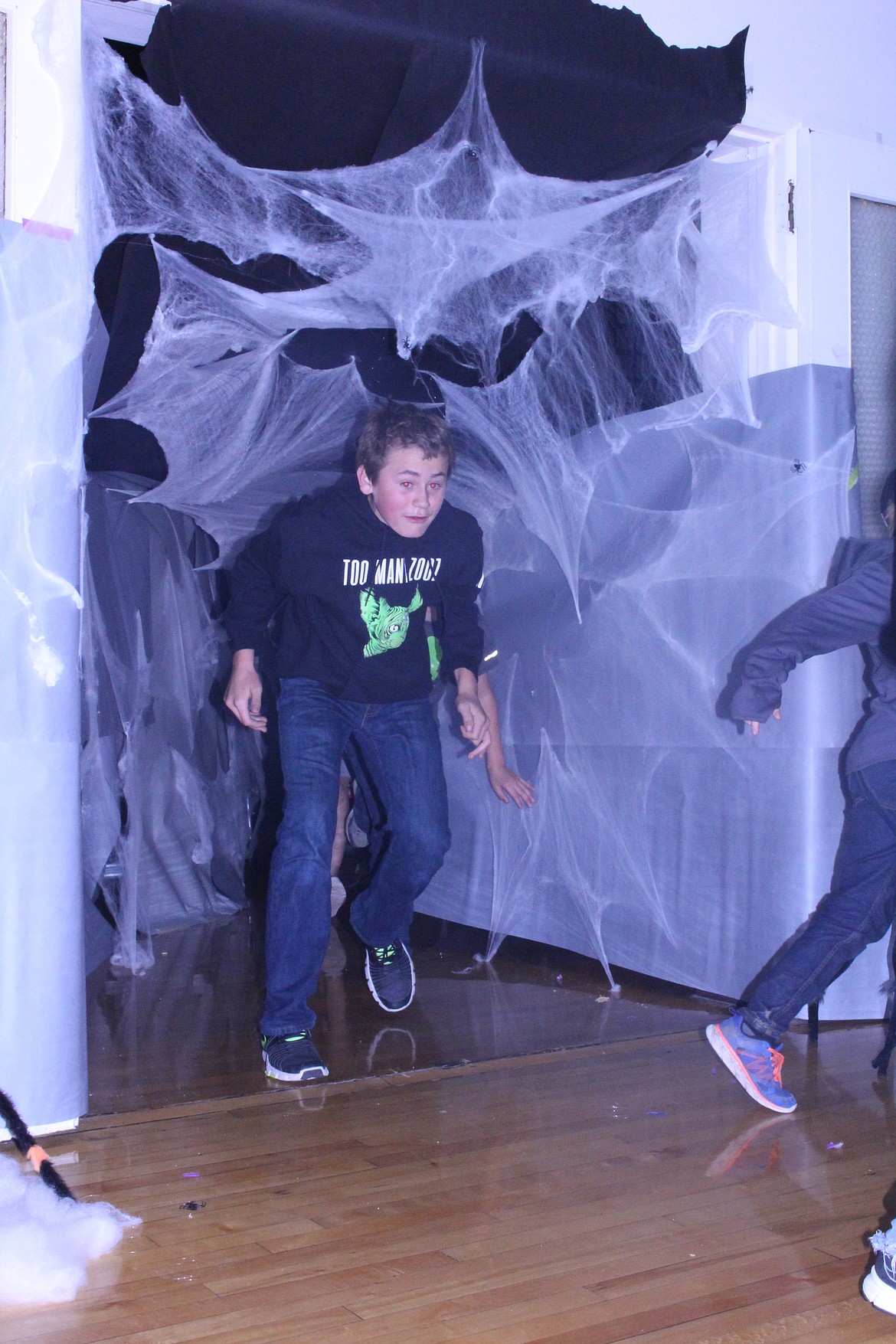 Visitors ran through a maze of webs and tunnels in order to escape the ghosts and goblins. (Photo by Jessica Maurer)