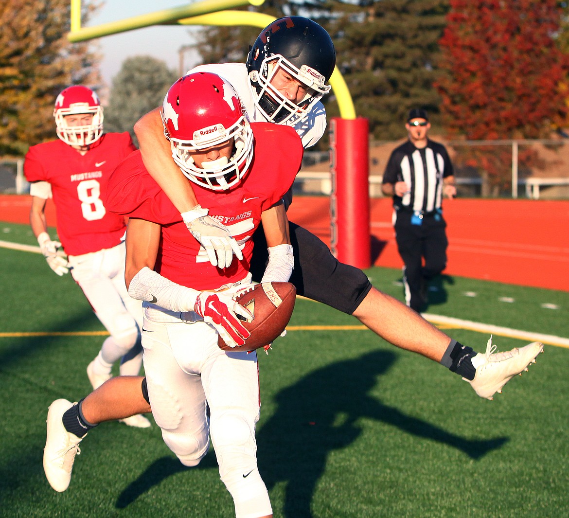 Rodney Harwood/Columbia Basin HeraldEphrata receiver Chris Walker (11) turns defender on this pass interception in the end zone Saturday in the CWAC third-place game.