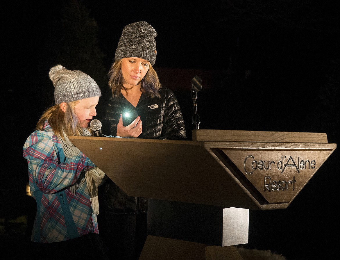 Standing next to her mother, Lyndsey Neufeld, Hailie Neufeld reads an excerpt about her fight with Type 1 diabetes to a crowd gathered on the lawn of The Coeur d&#146;Alene Resort during Diabetes Awareness Week last year.

Photos by LOREN BENOIT/Press File