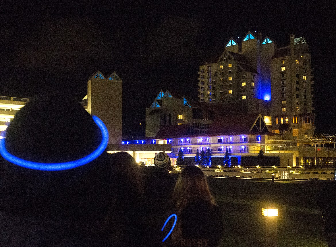 Bystanders watch as The Coeur d&#146;Alene Resort switch to blue lights during Diabetes Awareness Week last year.