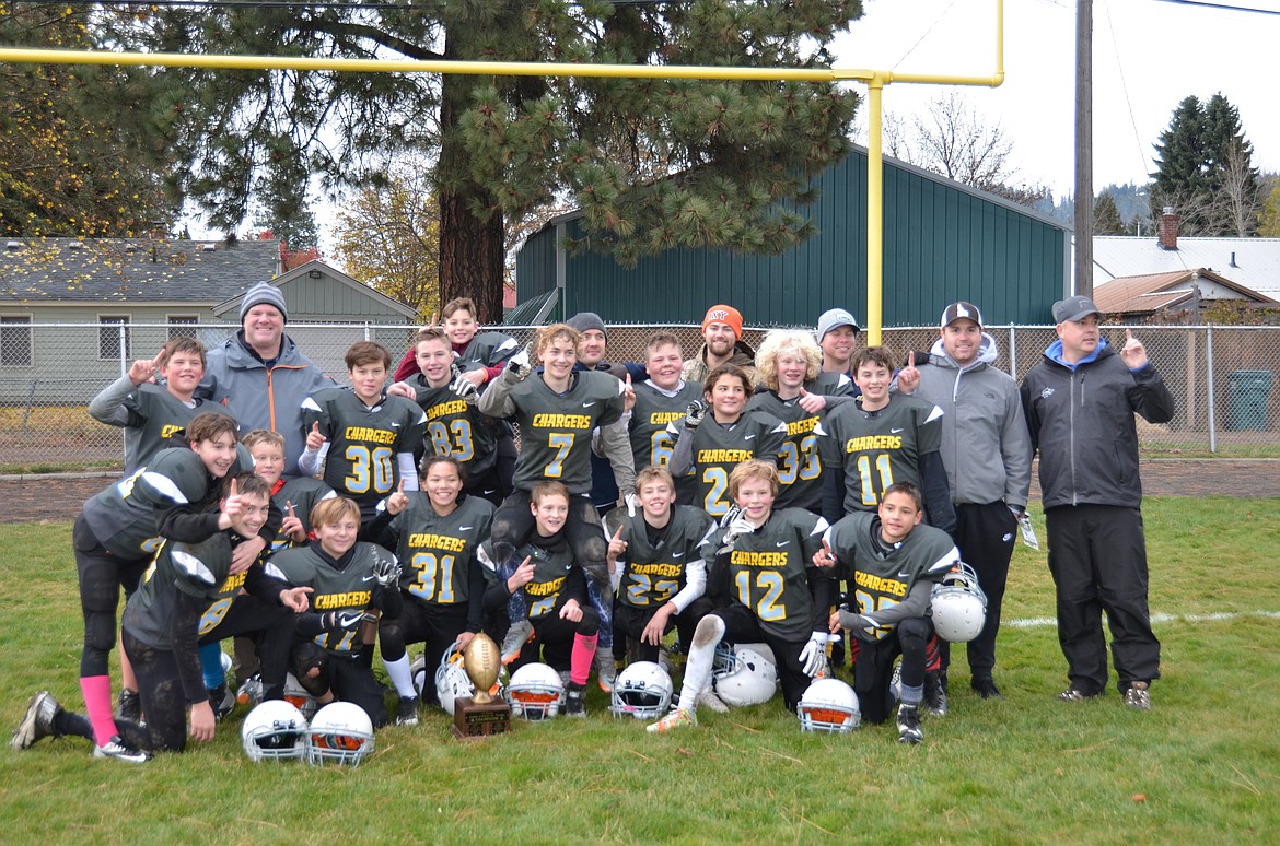 Courtesy photo
The Chargers seventh-grade Junior Tackle football team completed a perfect season with a 42-0 victory over second-place Timberlake for the league and city championship. Maddix Maciosek ran the opening kickoff 70 yards for a touchdown.  Maddix was also the game&#146;s leading rusher with 125 yards and another touchdown. Zach Johnson rushed for 35 yards and 2 touchdowns, and Sophia Richey also added a score. With tough passing conditions Varick Meredith scored on a 75-yard pass play from Kolton Mitchell. The Charger defense  allowed just 2 first downs in the game. The Chargers are now undefeated over 3 years with a record of 21-0.
In the front row from left are Jaxon Tyson, Zach Johnson,  Alex Green, Gage Henson, Sophia Richey, Kyle Bridge, Kolton Mitchell, Brodie Beebe and Rylan Judd; second row from left, Kole Sjostrom, Varick Meredith, Maddix Maciosek, Ashton Phay,  Brodie Waddell, Cooper Rasmussen and Colton Simkins; and back row from left, Brandon Eaton, coach Eric Johnson, Judah Lauri, coach Ben Widmyer, coach Kaleb Mitchell, coach Tom Barlow, coach Alex Hamill and coach Josh Beebe. Not pictured are Zak Shawver and coach Monte Meredith.