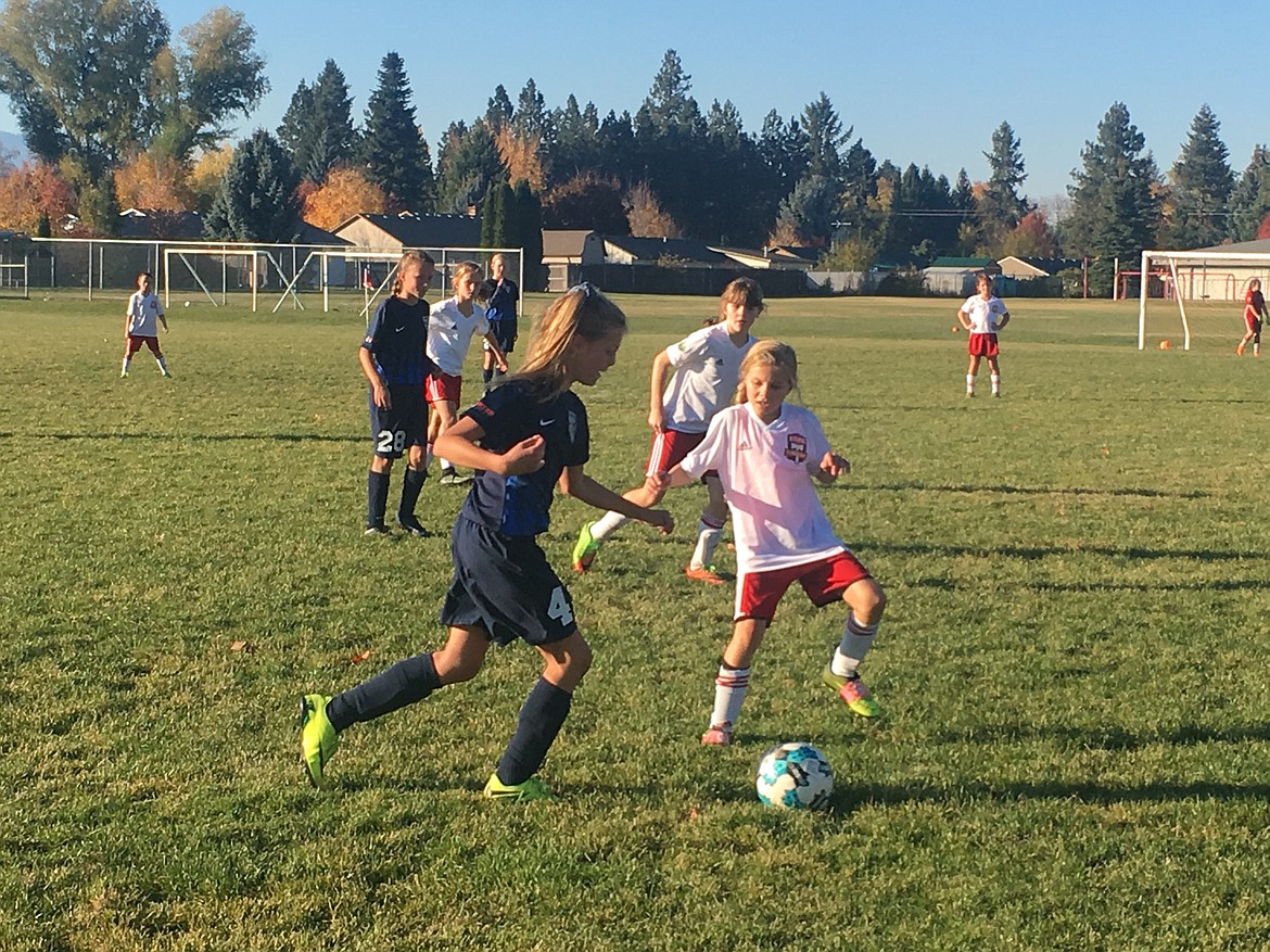 Courtesy photo
Avery Hickok, left, of the Sting Timbers under-10 girls soccer team moves the ball upfield in a recent game vs. Lewiston.