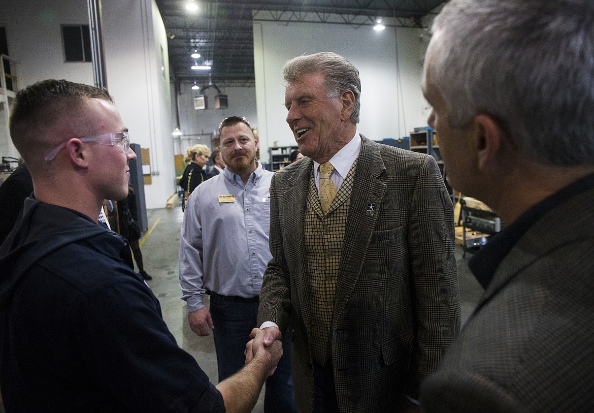 Idaho Gov. Butch Otter shakes Anthony Pangallo's hand during Otter's tour of Swiss Tech Precision in Post Falls on Wednesday. (LOREN BENOIT/Press)