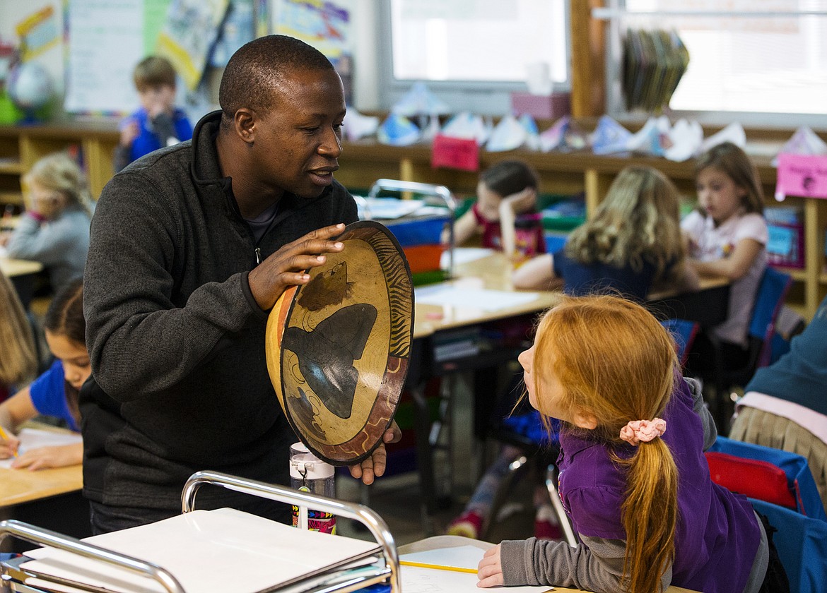 LOREN BENOIT/Press

Brave Sikangila, a medical coordinator from Zambia, shows second-grader Brynna Miller different African animals donned on a bowl during school Thursday afternoon at Sorensen Magnet School of Arts and Humanities.