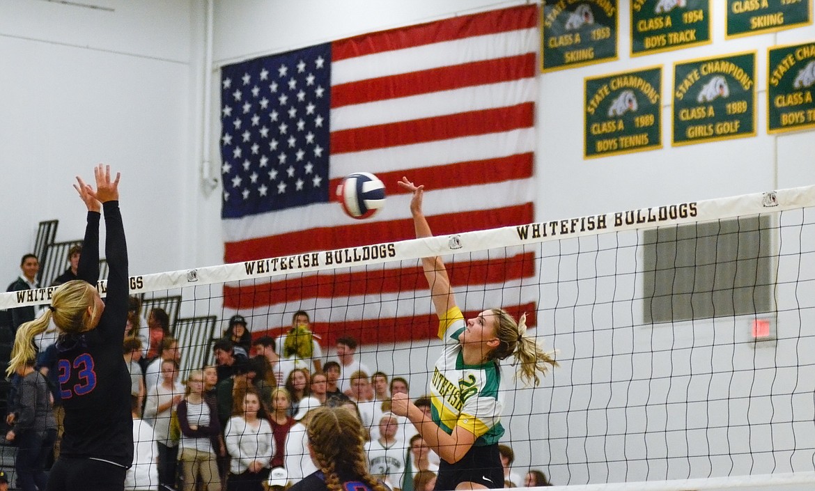 Whitefish's Cailyn Ross crushes the ball at the net against Columbia Falls in a match earlier this season. Whitefish opens the Class A state tournament today. (Daniel McKay/Whitefish Pilot)
