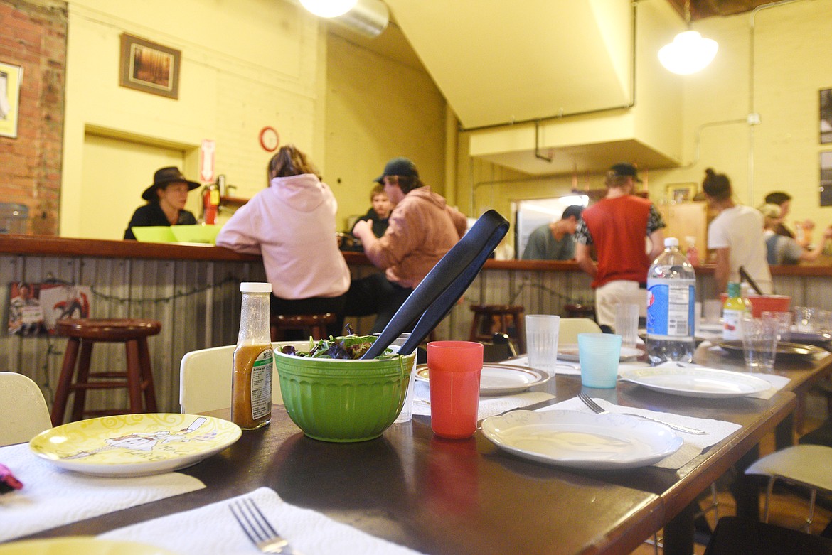 Clients prepare dinner at the Center for Restorative Youth Justice on Wednesday. (Aaric Bryan/Daily Inter Lake)