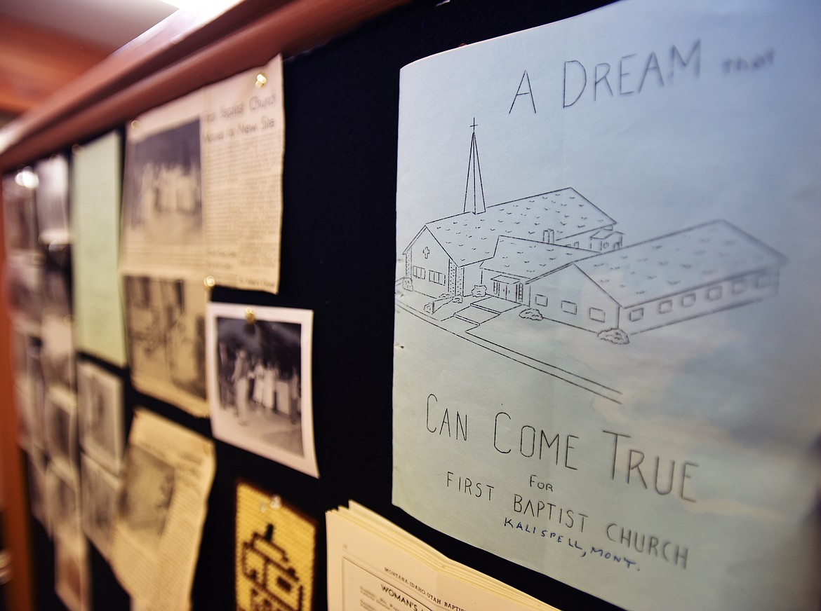 A photo board showing the history of the church with a pamphlet that reads: A Dream that Can Come True for First Baptist Church.(Brenda Ahearn/Daily Inter Lake)